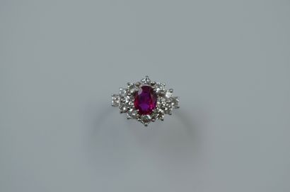 null 
Ring in 18k white gold surmounted by a 1.55ct oval Burmese ruby in a setting...