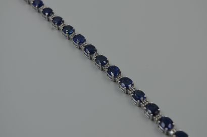 null Bracelet line in 18k white gold decorated with 21 oval sapphires for 25cts approximately...