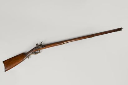 Flintlock rifle.

Long barrel with sides,...