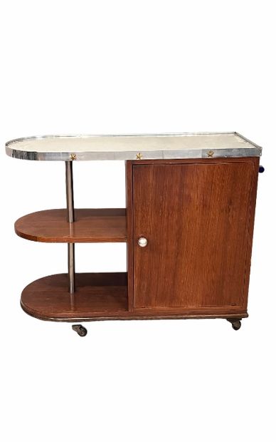 null Sideboard forming a bar, in wood veneer. Mirror top circled with a metal blade...