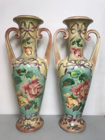null Pair of urn vases with handles in polychrome porcelain decorated with roses...