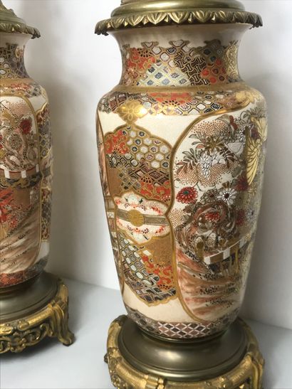 null JAPAN Satsuma, 20th century
Pair of vases mounted as oil lamps 
Height: 86 cm....