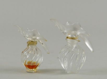 null NINA RICCI "L'air du Temps
Two bottles stoppers two doves, 30ml, one full and...