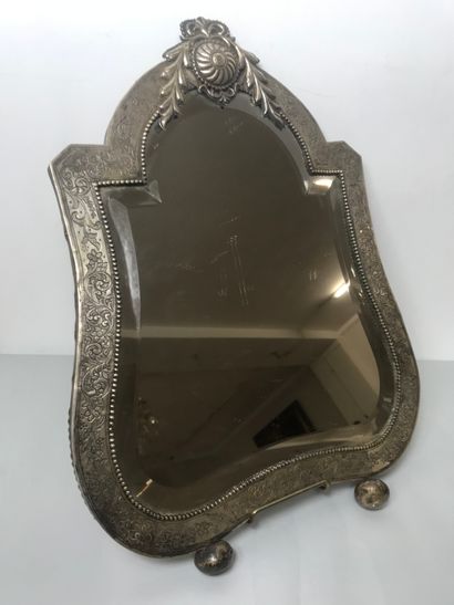 null Table mirror framed with a silver plate on a wooden core, with incised decoration...
