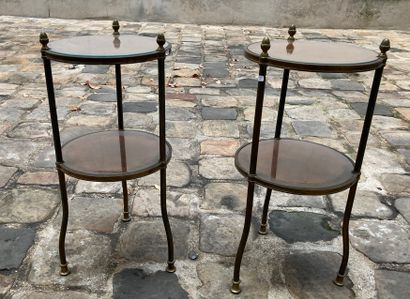 null Pair of small pedestal tables with two circular wooden trays, covered with leather...