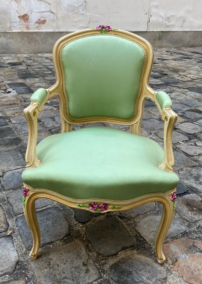 null Pair of medallion armchairs, one lined with pink fabric, the other green. Beige...