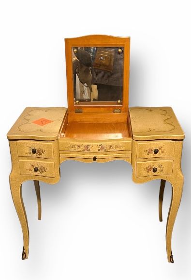 null Wooden dressing table with painted flowers and foliage on a cracked background....