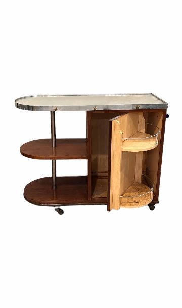 null Sideboard forming a bar, in wood veneer. Mirror top circled with a metal blade...