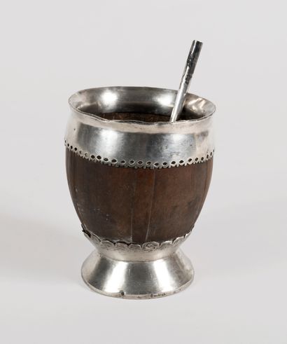 null Cup with mate and its bombilla. 
The body of the cup in exotic wood rests on...