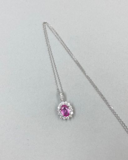 null 18k white gold oval pendant set with a 1ct oval pink sapphire in a setting of...