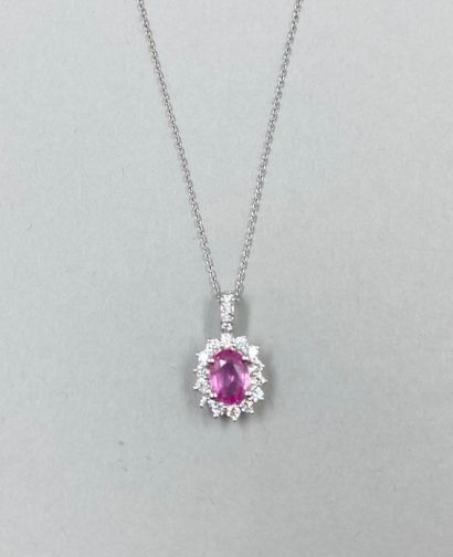 null 18k white gold oval pendant set with a 1ct oval pink sapphire in a setting of...