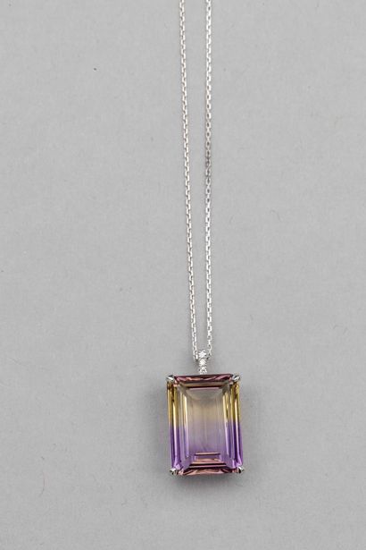 null Pendant in 18k white gold topped by an emerald-cut ametrine of 9cts approximately,...