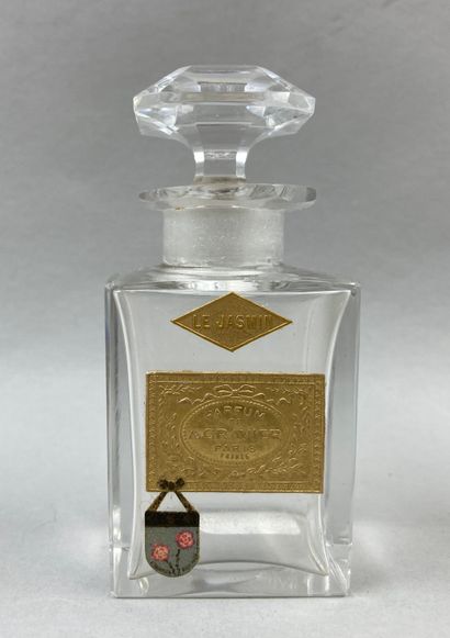 null A. GRAVIER " Le jasmin ".

Square shaped crystal bottle, two gold labels, titled...
