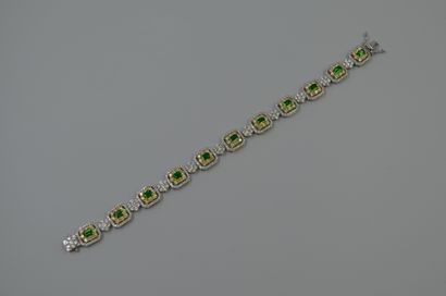 null White gold and 18k yellow gold bracelet composed of rectangular openwork links,...