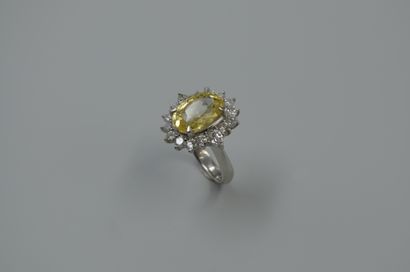 null Platinum daisy ring set with an oval yellow sapphire of 8cts in a diamond setting...