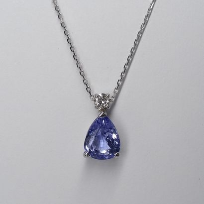 null Pendant in 18k white gold set with a pear-cut purple sapphire of about 2cts,...