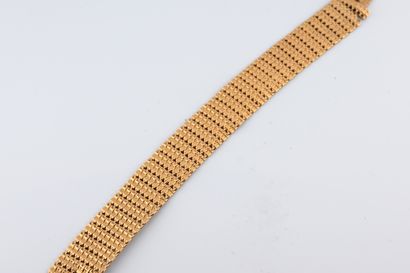 null Bracelet souple en or jaune 18k 
Poids : 23,60gr. Longueur : 18,5cm. 
(Acci...