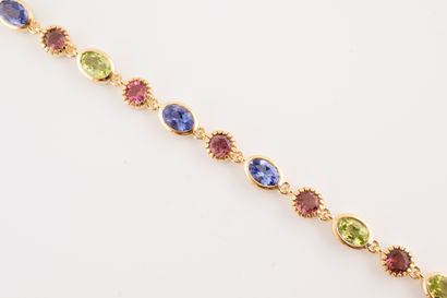 null Bracelet souple en vermeil orné de tanzanites, tourmalines roses et péridots....