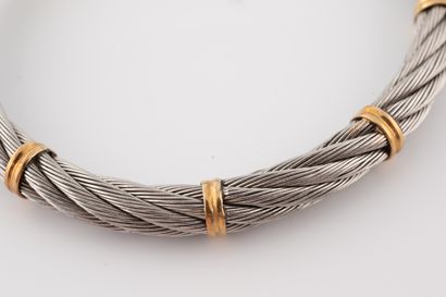 null Bracelet jonc ouvert formé de câbles d'acier torsadés, agrémentés de cinq doubles...