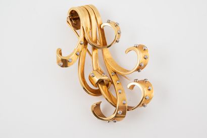 null VAN CLEEF ARPELS
Broche à entrelacs enrubannés en or jaune 18k agrémentée de...