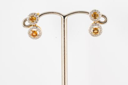 null Earrings in silver gilt (vermeil) decorated with orange tourmalines in a surround...