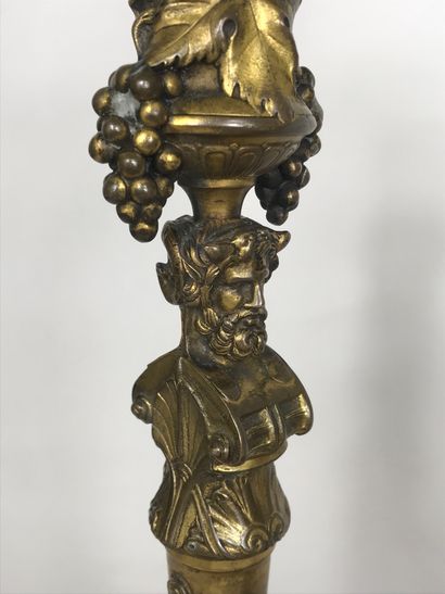 null French school XXth century 
Pair of brass candlesticks decorated with figures...
