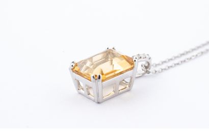 null 18k white gold pendant set with an emerald-cut citrine weighing approximately...