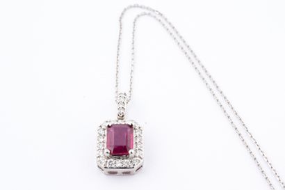 null 18k white gold pendant centered on an emerald-cut ruby of 1ct in a diamond setting,...