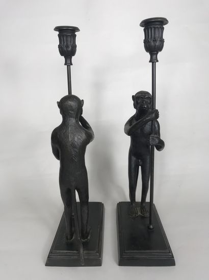 null French school XXth century 
Pair of candlesticks featuring monkeys holding torches...