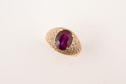 null Dome ring in 18k yellow gold with a deep red oval ruby of about 4cts in a diamond...
