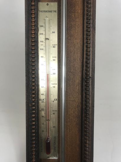 null Barometer-thermometer with mercury on a natural wood blade decorated with a...