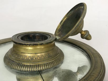 null Inkwell of circular form with mirror bottom and gilded bronze decorated with...