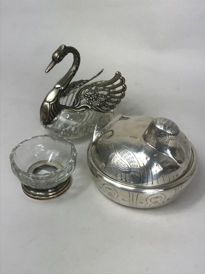 null Lot composed of a hammered silver metal box representing a stylized bird, a...