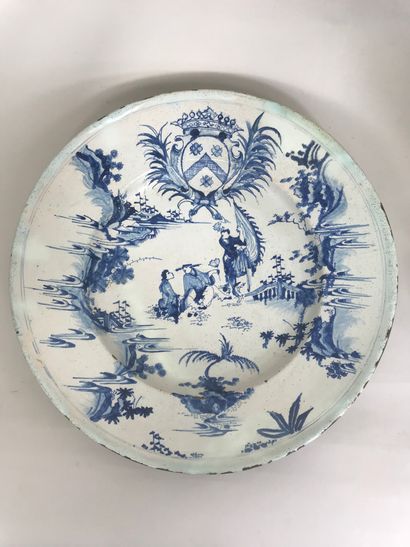 null DELFT, 18th century 
Large earthenware dish decorated with exotic characters...