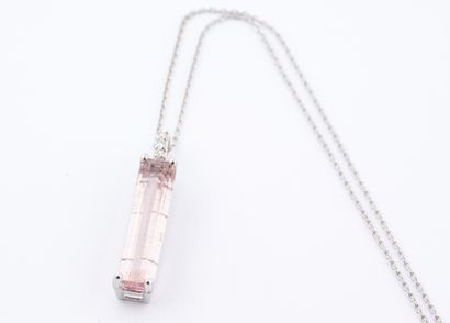 null 18k white gold pendant set with an emerald-cut pink tourmaline weighing approximately...
