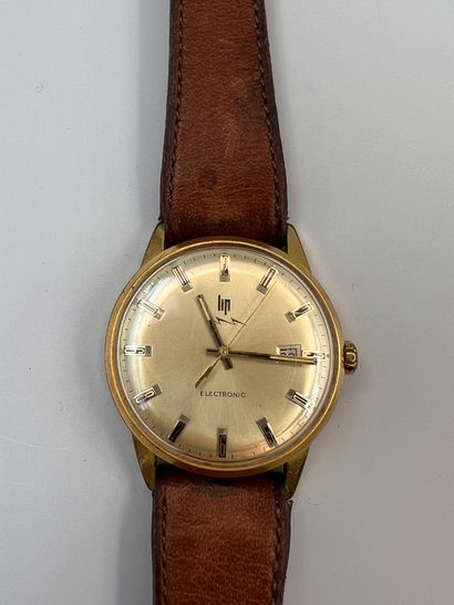 null LIP Electronic, About 1970.
Gold-plated wristwatch, gold dial, Arabic numerals,...