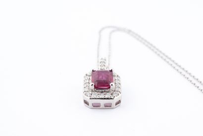 null 18k white gold pendant centered on an emerald-cut ruby of 1ct in a diamond setting,...