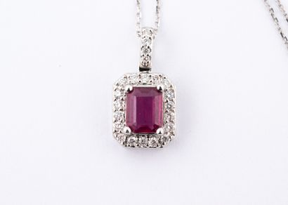 null 18k white gold pendant centered on an emerald-cut ruby of 1ct in a diamond setting,...