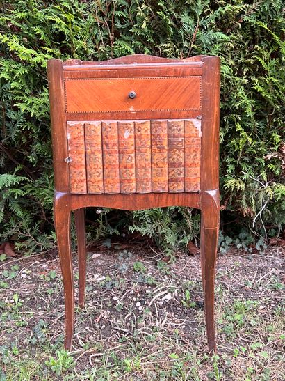 null Bedside table in marquetry veneer. Opens to a leaf in simulated books and a...