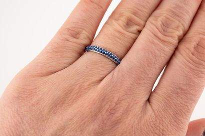 null Ring in 18k white gold set with two lines of synthetic sapphires. 
Gross weight:...