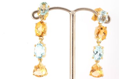 null Pair of gilded silver (vermeil) earrings clawed with blue topazes and citrines....