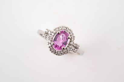 null Ring in 18k white gold set with a pink sapphire of about 1ct in a diamond setting....