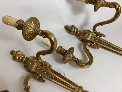 null Pair of ormolu sconces with two arms of light, decorated with interlacing, flowers...
