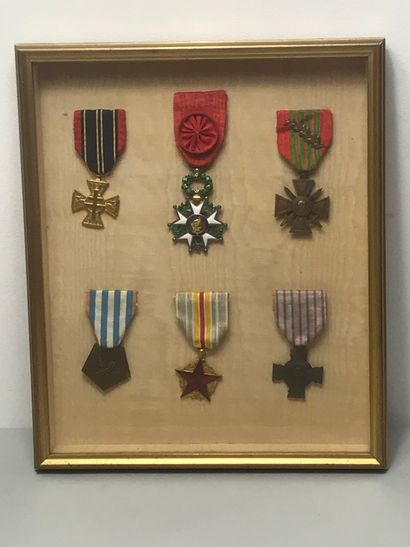 null Lot of six military medals under frame composed of a cross of officer of the...