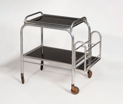 null Serving table on casters, in chromed tubular metal with two smoked glass tops....
