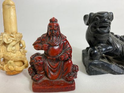 null Lot including a cigarette holder, a figurine of warrior in red resin and a dog...