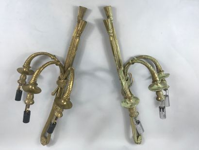null Pair of ormolu sconces with three arms of light decorated with knotted ribbons,...