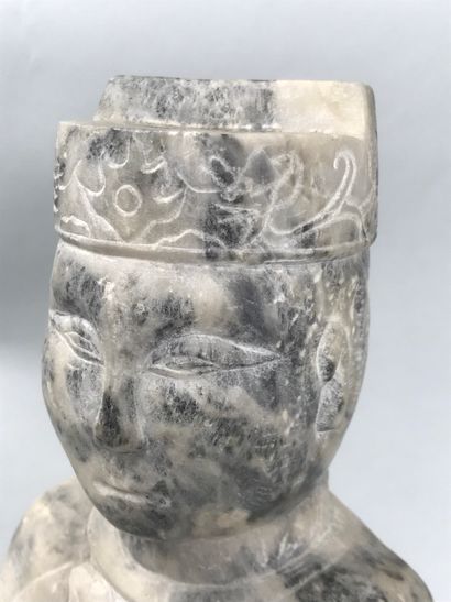 null CHINA, 20th century 
Seated marble dignitary holding a lotus branch in his right...
