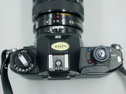 null Nikon EM camera, with its SOLIGOR Macro 3.5/105mm lens, Japan. 
In a Minolta...