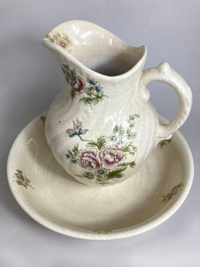 null Basin and pitcher in cracked earthenware cream color, with flowered decoration....